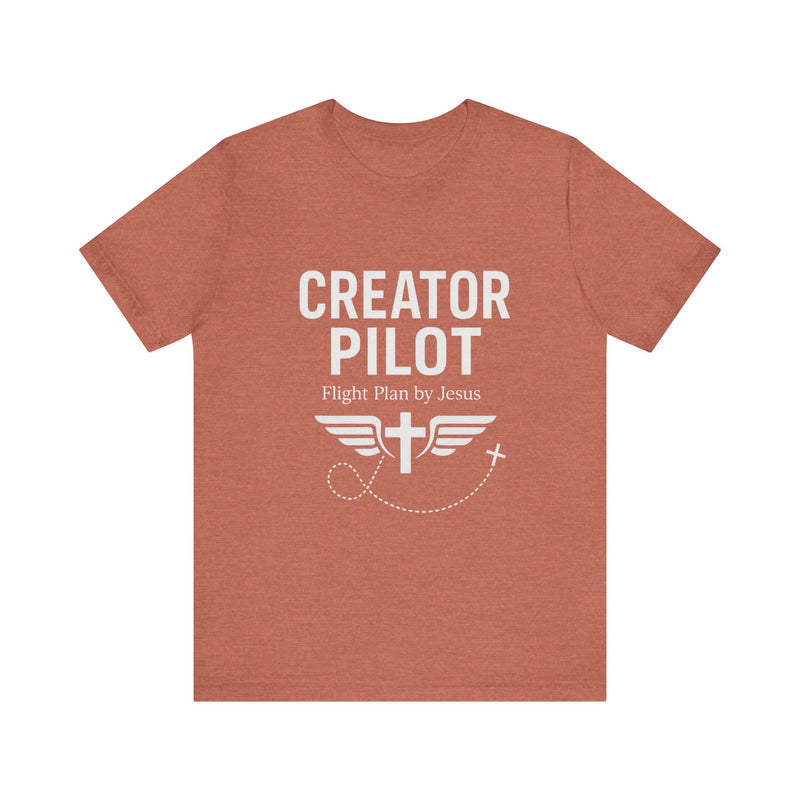 Faith-based t-shirt with “Creator Pilot” text, flight emblem with cross and wings, Christian apparel for Kingdom creators.