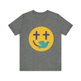 Woman wearing a navy Christian t-shirt with a smiley face design featuring purple cross eyes and a blue dove forming the smile.