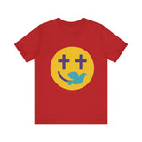 Woman wearing a navy Christian t-shirt with a smiley face design featuring purple cross eyes and a blue dove forming the smile.