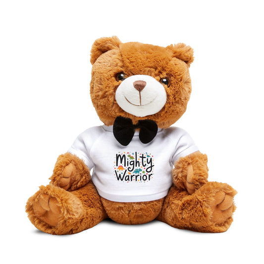 Teddy bear wearing a “Mighty Warrior” shirt, sitting upright with a brave expression, symbolizing strength and faith for kids.