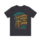 "Model wearing God Works Against the Grain Christian t-shirt in black, faith-based streetwear style by Klippette."