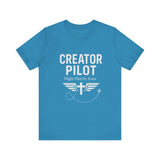Faith-based t-shirt with “Creator Pilot” text, flight emblem with cross and wings, Christian apparel for Kingdom creators.