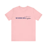 Typography shirt design reading “We Work Well Together” with a cross-inspired T, representing unity with Jesus.