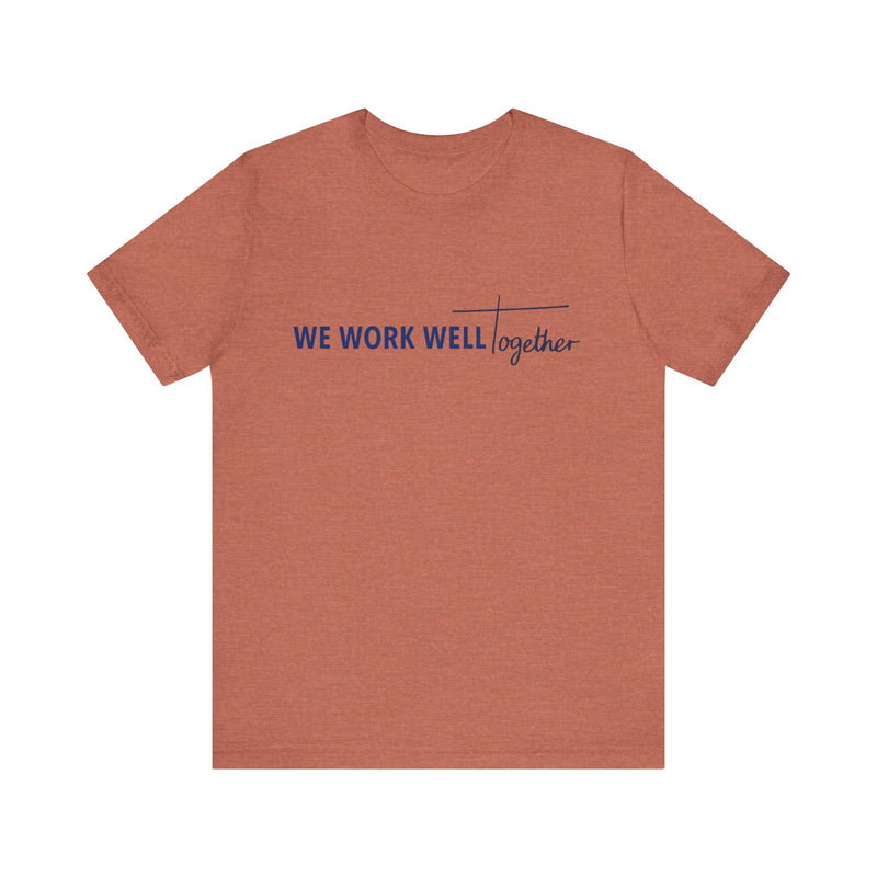 Typography shirt design reading “We Work Well Together” with a cross-inspired T, representing unity with Jesus.