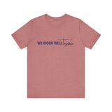 Typography shirt design reading “We Work Well Together” with a cross-inspired T, representing unity with Jesus.