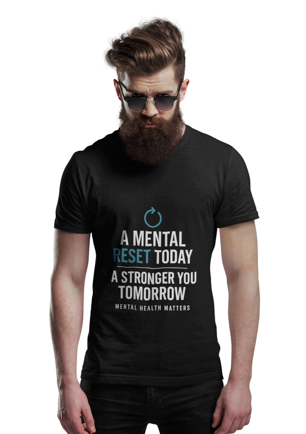 Man wearing a black t-shirt with motivational quote on a white background