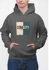 A hoodie with a bold, graphic design featuring the word “STABILITY” split across two contrasting colored backgrounds, with half the word on each side. Referenced scripture Isaiah 26:3 anchors the message visually and spiritually.