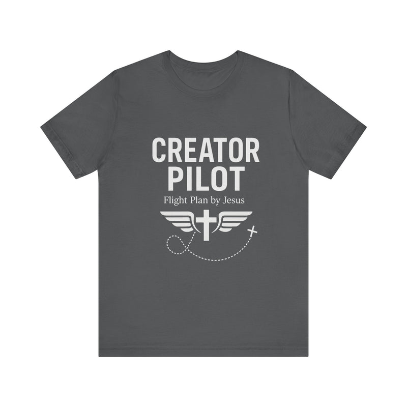 Faith-based t-shirt with “Creator Pilot” text, flight emblem with cross and wings, Christian apparel for Kingdom creators.