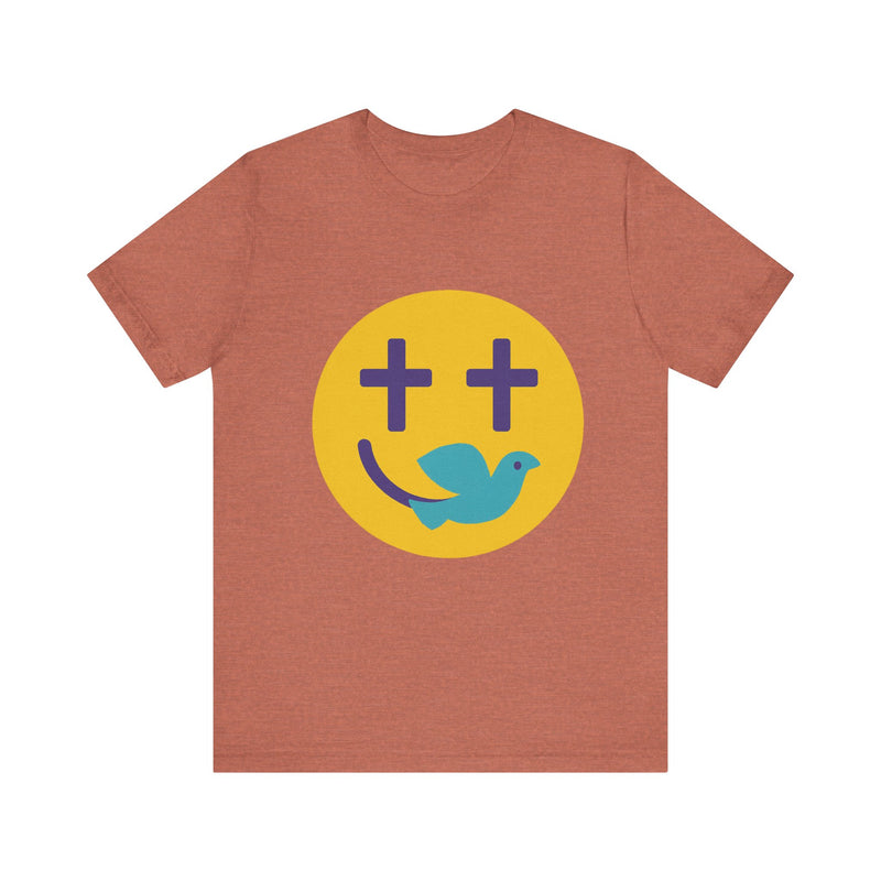 Woman wearing a navy Christian t-shirt with a smiley face design featuring purple cross eyes and a blue dove forming the smile.