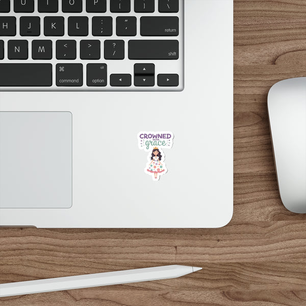 Laptop with a sticker on a wooden desk with a mouse and stylus.