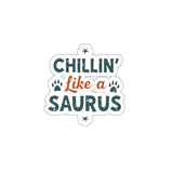 Sticker with “Chillin’ Like a Saurus” in stonewashed green, accented by tiny dinosaur feet. 