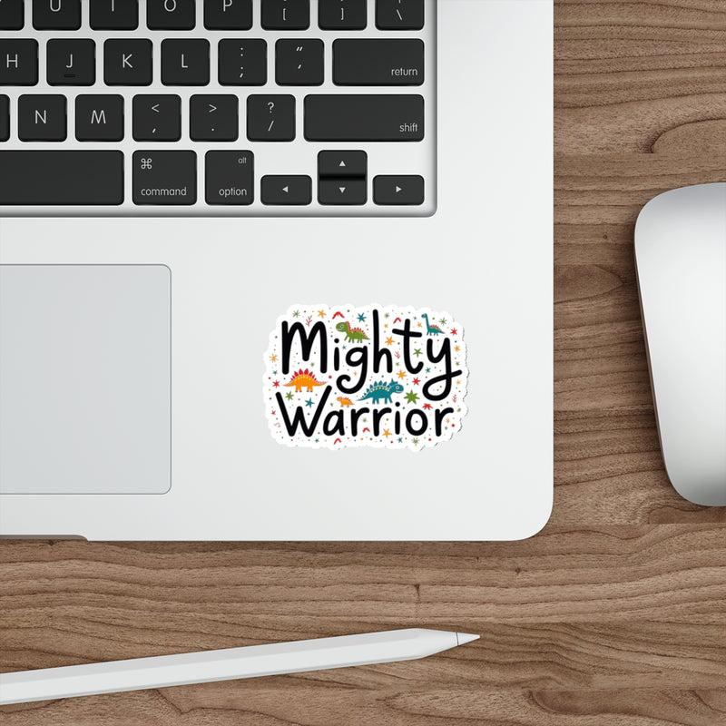 Laptop with a 'Mighty Warrior' sticker on a wooden desk