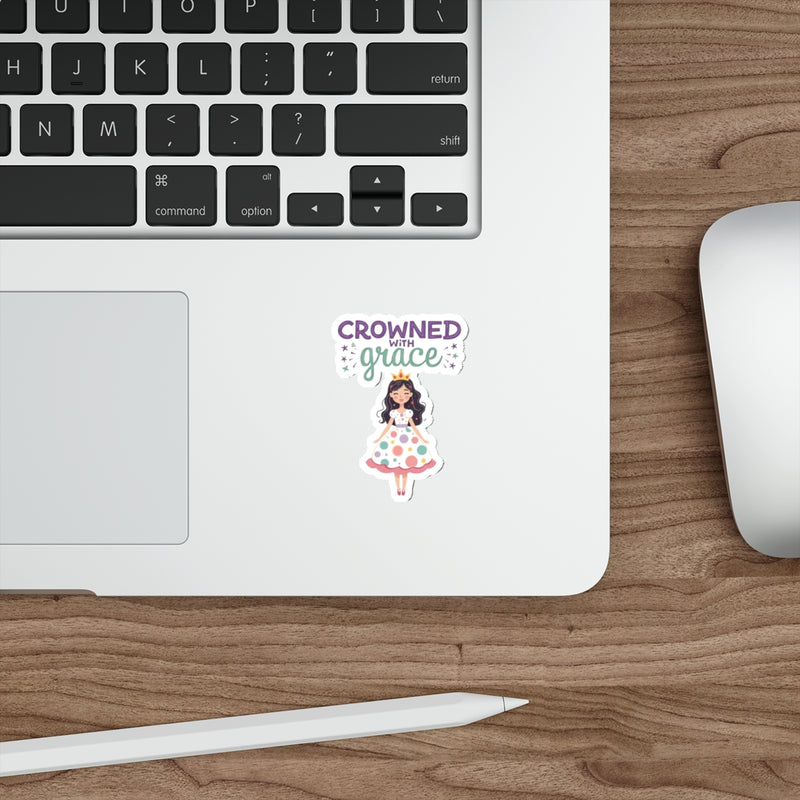 Sticker with 'Crowned with Grace' design on a laptop