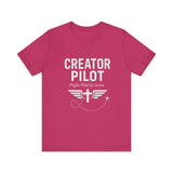 Faith-based t-shirt with “Creator Pilot” text, flight emblem with cross and wings, Christian apparel for Kingdom creators.